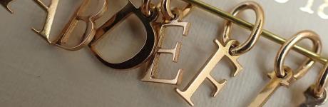Cutted gold letters Fournier