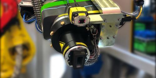 Mini-inline with fiber laser marking machine mounted to robot arm