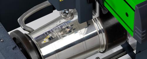Beer mug being engraved with M40