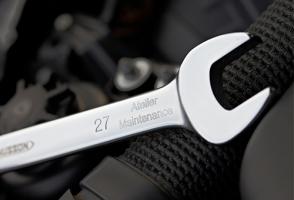 Tool identification on a metal wrench marked with number and workshop name